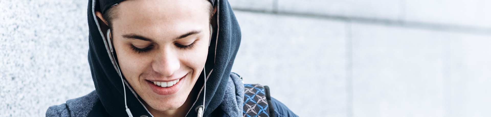 Young person smiling with earphones